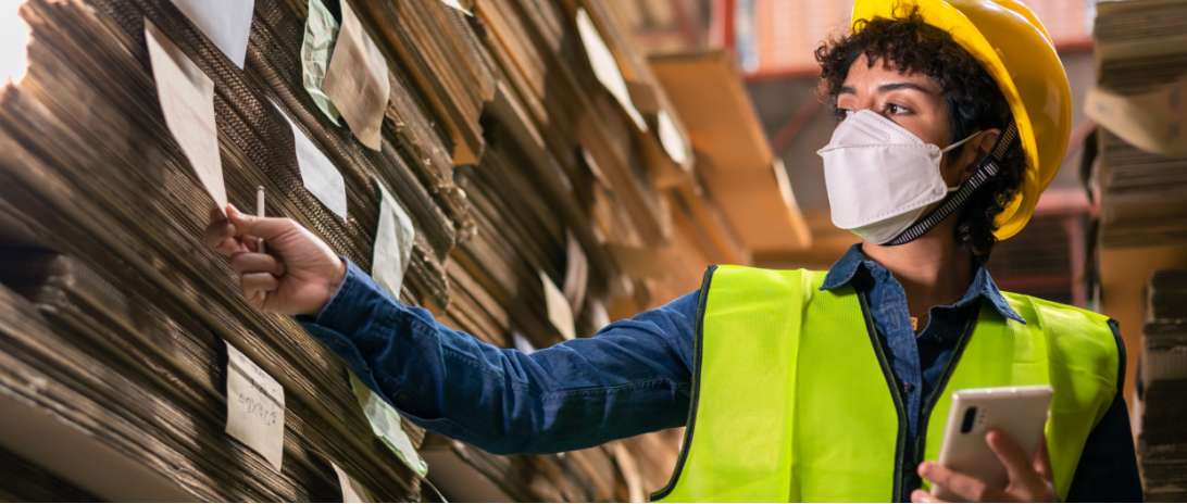 Two industrial workers looking at a paper